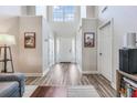 Bright foyer boasts soaring ceilings, hardwood floors and decorative accents at 8842 Gable St, North Charleston, SC 29406