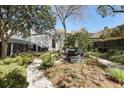 A private backyard features outdoor seating and lush landscaping at 99 Logan St, Charleston, SC 29401