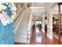 Grand two-story foyer featuring hardwood floors, a staircase, and ample natural light at 1067 Shipton Ct, Charleston, SC 29414