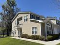 Exterior side view of home with neutral siding and manicured bushes at 111 Spanish Oak Ln, Ladson, SC 29456