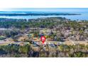 Scenic aerial view showcasing a lush, green neighborhood near the water at 112 Lois Cir, Moncks Corner, SC 29461