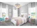 Inviting bedroom with soft lighting, a decorative chandelier, and coordinated furnishings at 114 Snow St, Summerville, SC 29486