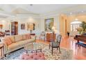 Spacious living room showcasing a hardwood floor, comfortable seating, and elegant decor at 1213 Waterfront Dr, Mount Pleasant, SC 29464
