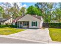 Well-maintained single-story home with tidy lawn and a concrete driveway and walkway at 1257 Maryland Dr, Ladson, SC 29456