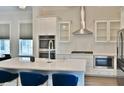 A gourmet kitchen with white cabinetry, stainless steel appliances, and a large island, perfect for cooking and entertaining at 1510 Cecile St, Mount Pleasant, SC 29464
