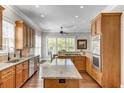 Spacious kitchen with wood cabinets, granite countertops, stainless steel appliances and large island at 1626 Bull Creek Ln, Charleston, SC 29414