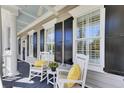 Relaxing porch with comfortable seating, stylish decor, and natural light at 1626 Bull Creek Ln, Charleston, SC 29414
