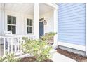 A cozy front porch featuring rocking chairs and decorative plants offering a warm welcome to the home at 1984 Shadetree Blvd, Johns Island, SC 29455