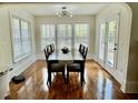 Sunlit dining room with a large table, hardwood floors, and classic finishes at 203 Arbor Oaks Dr, Summerville, SC 29485