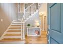 Welcoming foyer with hardwood floors and a staircase, offering a glimpse into the home's layout at 2072 Middleburg Ln, Mount Pleasant, SC 29464