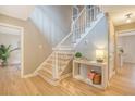 Bright foyer showcasing hardwood floors, a staircase, and a decorative console table at 2072 Middleburg Ln, Mount Pleasant, SC 29464
