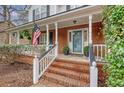 Inviting front porch with brick steps and white railings, perfect for relaxing outdoors at 2072 Middleburg Ln, Mount Pleasant, SC 29464