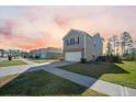 Charming two-story home featuring a manicured lawn and attached two-car garage, in a Gathering-friendly neighborhood at 225 Sedona Dr, Summerville, SC 29486