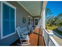 Cozy balcony furnished with rocking chairs and a tranquil view at 2322 Dorado Ct, Johns Island, SC 29455