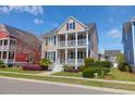 Charming two-story home with double porches, lovely landscaping, and inviting curb appeal at 2353 Eagle Creek Dr, Charleston, SC 29414
