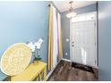 Entryway showcasing a stylish table, hardwood floors, decorative vase, and a welcoming ambiance at 2431 Thoreau Ln, Charleston, SC 29406