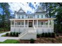 Beautiful two-story home with inviting front porch and manicured landscaping at 2501 Clear Marsh Rd, Seabrook Island, SC 29455
