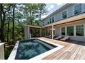Inviting pool with a wooden deck area and lounge chairs for relaxation at 2501 Clear Marsh Rd, Seabrook Island, SC 29455