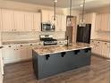 Spacious kitchen with granite countertops, an island, pendant lighting, and stainless steel appliances at 280 Godwit Dr, Summerville, SC 29486
