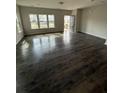 Open-concept living room with ample natural light and hardwood flooring at 280 Godwit Dr, Summerville, SC 29486