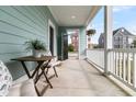 Spacious front porch with comfortable seating, perfect for relaxing outdoors at 2837 Rutherford Way, Charleston, SC 29414