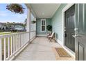 Welcoming front porch with cozy seating and decorative plants at 2837 Rutherford Way, Charleston, SC 29414