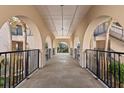 Exterior walkway featuring beautiful arches and providing access to the living spaces at 3005 Ocean Winds Dr, Seabrook Island, SC 29455