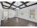 Sunlit living room with hardwood floors, coffered ceilings, a fireplace, and built-in shelving at 311 Black St, Walterboro, SC 29488