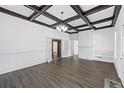 Bright living room with hardwood floors, coffered ceilings, a fireplace, and plenty of natural light at 311 Black St, Walterboro, SC 29488