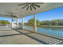 Spacious screened porch overlooking a serene body of water and lush green trees at 3419 Myrtle St, Edisto Island, SC 29438