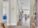 Inviting foyer with hardwood floors, molding, and entry to the living area at 345 Turnstone St, Mount Pleasant, SC 29464