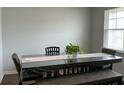 Eat-in kitchen dining space with a large table with chairs and bench seat with light from window at 413 Cedarview Rd, Summerville, SC 29486