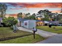 Charming single-story home with manicured lawn and large PODS container in the driveway at 4984 Foxwood Dr, North Charleston, SC 29418