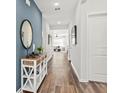 Inviting entryway with hardwood floors, wainscotting, and stylish console table at 731 Meadowbrook Ln, Summerville, SC 29486