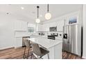 Bright kitchen featuring stainless steel appliances, white cabinets, and a center island at 731 Meadowbrook Ln, Summerville, SC 29486