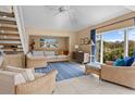 Bright living room with high ceilings, tile floors, and expansive windows showcasing natural views at 740 Spinnaker Beachhouses, Seabrook Island, SC 29455
