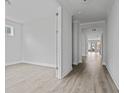 Hallway leading to another room with an open doorway and neutral colored floors at 752 Maynard Ln, Summerville, SC 29486