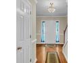 Bright foyer with hardwood floors, elegant lighting, and a welcoming entrance to the home at 9360 S Moreto Cir, Summerville, SC 29485