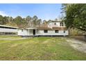Exterior elevation of home with welcoming front porch and spacious front yard at 117 Wernham Ln, Moncks Corner, SC 29461