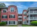 Multi-story exterior of the building with a stucco facade and balconies at 1223 Telfair Way Way, Charleston, SC 29412