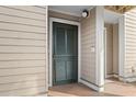Condo entrance with a green louvered door and beige siding at 157 High Hammock Villas, Seabrook Island, SC 29455