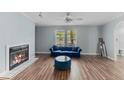 Inviting living room with cozy fireplace, wood floors, and plenty of natural light at 158 Dean Dr, Summerville, SC 29483