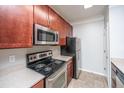 This kitchen is equipped with stainless steel appliances and granite countertops at 1755 Central Park Rd # 3102, Charleston, SC 29412