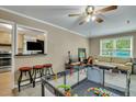 Open living area featuring a pass-through window and neutral decor at 1932 Sunnyvale Ave, Charleston, SC 29414