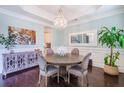 Dining room with hardwood floors, chandelier, and views to the kitchen at 2447 Louisville St, Charleston, SC 29492