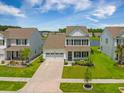 Charming two-story home featuring a well-manicured lawn, a two-car garage, and classic black shutters at 260 Dunlin Dr, Summerville, SC 29486