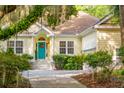 Welcoming exterior showcasing the front door, lush landscaping, and charming details at 2737 Old Forest Dr, Seabrook Island, SC 29455