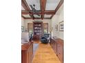 Cozy office with custom built-ins, coffered ceilings, and ample natural light at 278 Furman Farm Pl, Daniel Island, SC 29492