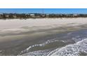 Beautiful beachfront view of homes along a sandy shoreline at 2906 Palm Blvd, Isle of Palms, SC 29451