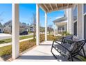 Cozy front porch with seating and scenic neighborhood views at 384 Ripple Park Dr, Summerville, SC 29486